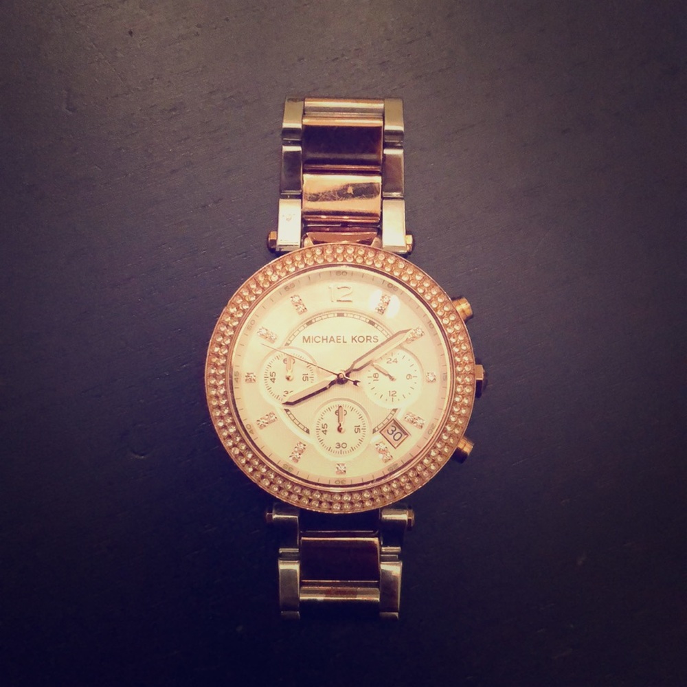 Michael Kors rose gold watch .